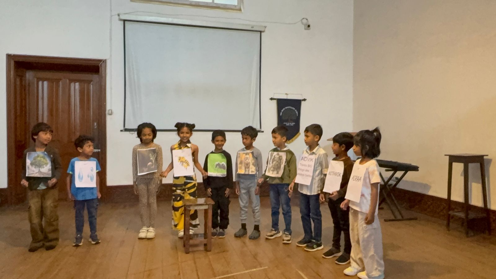 A student dressed as a tree joins the cast of small and large characters