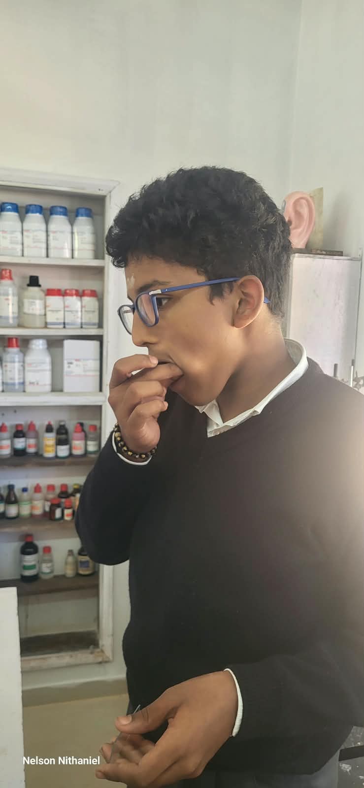 A student preparing to collect their cheek cell sample