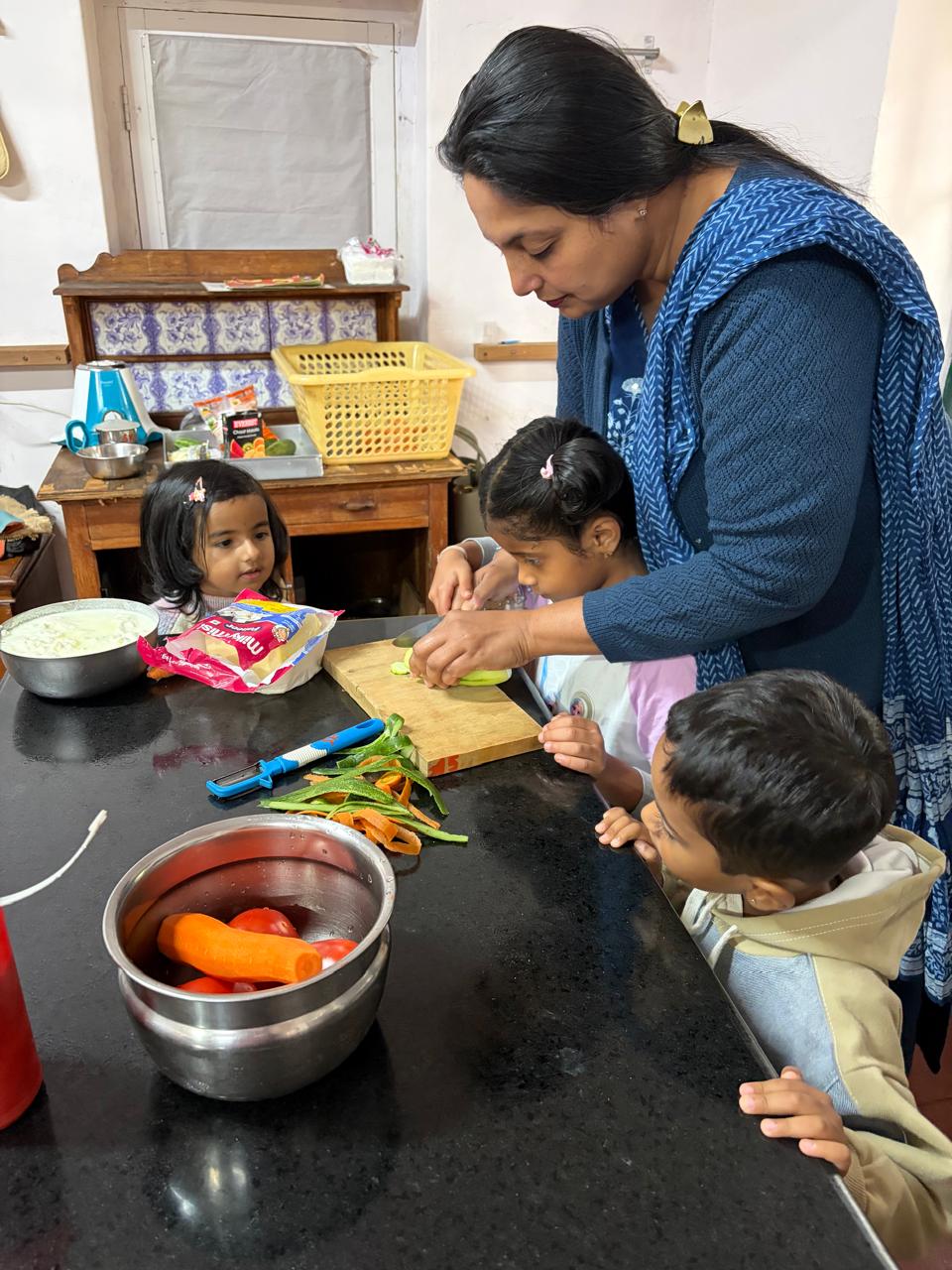 teacher helping a first step child assemble a sandwich at bms