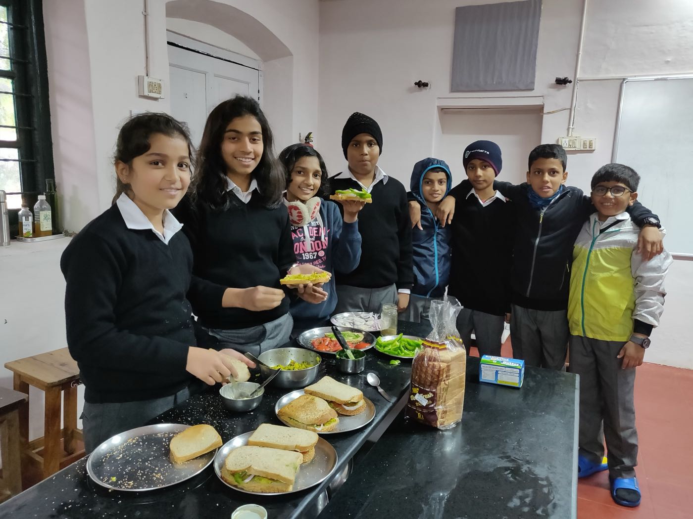 Grade 6 students with their Bombay Masala Veg Grilled Sandwiches at bms
